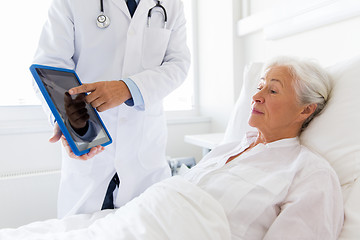 Image showing senior woman and doctor with tablet pc at hospital