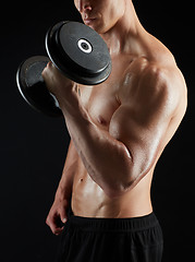 Image showing close up of man with dumbbells exercising