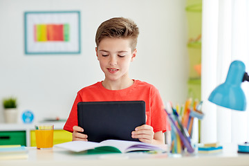 Image showing student boy with tablet pc and notebook at home