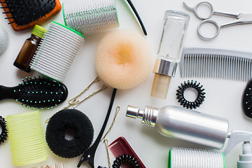 Image showing hair donuts, styling sprays, curlers and pins