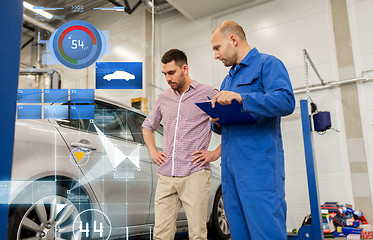 Image showing auto mechanic with clipboard and man at car shop