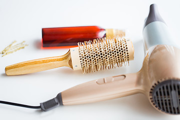 Image showing hairdryer, brush, hot styling hair spray and pins