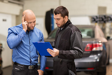 Image showing auto mechanic and customer at car shop