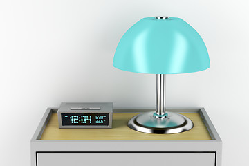 Image showing Nightstand with alarm clock and lamp