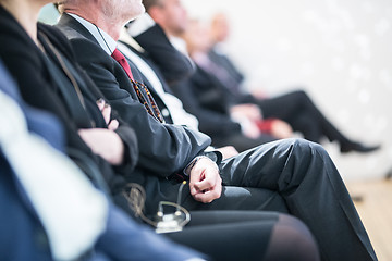 Image showing Row of business people sitting at seminar.