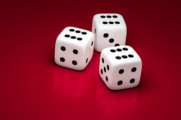 Image showing three white dice on a red background