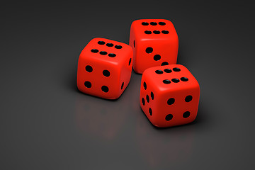 Image showing three red dice on a gray background