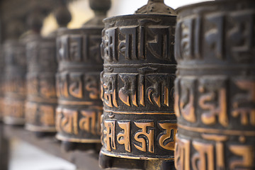 Image showing Buddhist prayer wheels in row 