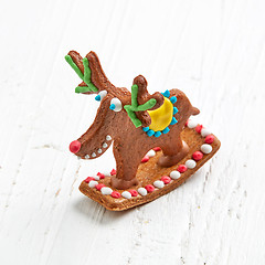 Image showing gingerbread deer on white wooden table