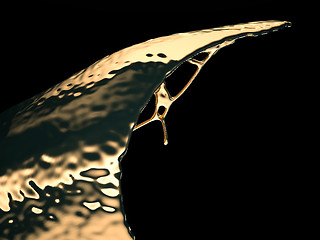 Image showing Liquid gold or oil splashes isolated on black