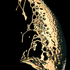 Image showing Liquid gold or oil splashes isolated on black