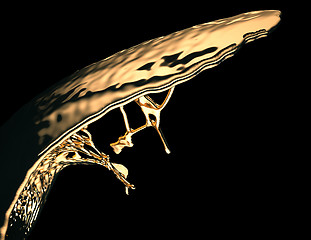 Image showing Liquid gold or oil splatter and splashes isolated on black