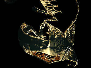 Image showing Melted gold or oil splashes isolated on black