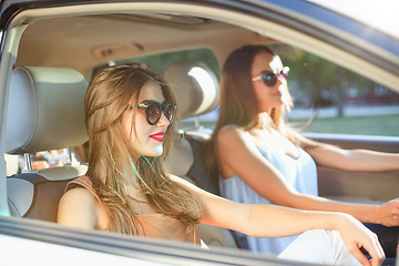 Image showing young women in the car smiling