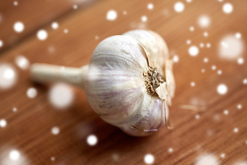 Image showing close up of garlic on wooden table