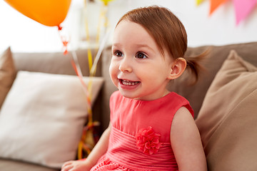 Image showing happy baby girl on birthday party at home