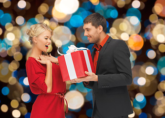 Image showing happy couple with christmas gift