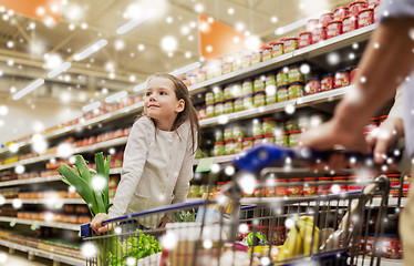 Image showing child with father buying food at grocery store