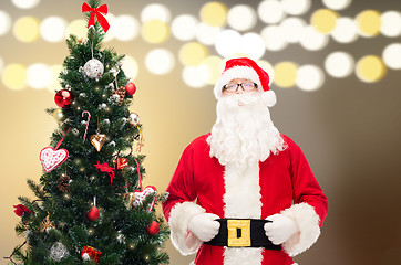 Image showing santa claus at christmas tree