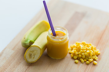 Image showing jar with banana fruit puree or baby food and corn