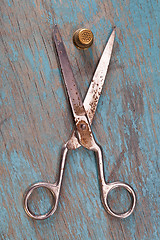 Image showing Retro sewing accessories on blue wooden background