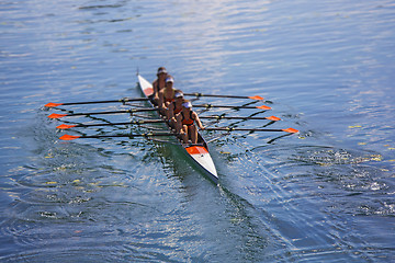 Image showing Team of rowing Four-oar women in boat 