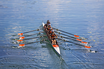 Image showing Team of rowing Four-oar women in boat 