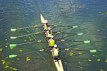 Image showing Team of rowing Four-oar women in boat 