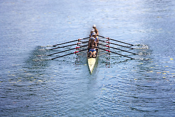 Image showing Team of rowing Four-oar women in boat 