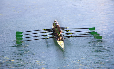 Image showing Team of rowing Four-oar women in boat 