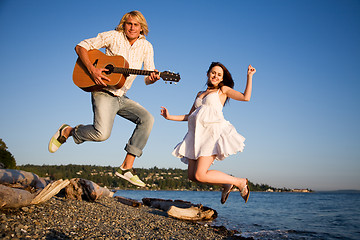 Image showing Jumping couple in happiness