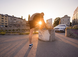 Image showing man tying running shoes laces