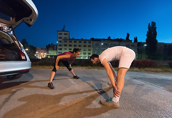 Image showing couple warming up and stretching