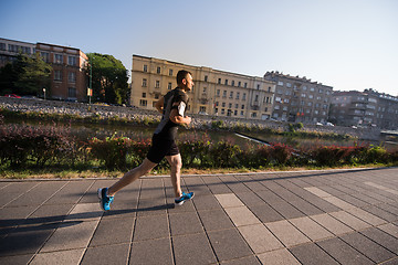 Image showing man jogging at sunny morning