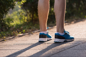 Image showing woman jogging at sunny morning