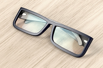 Image showing Eyeglasses on wood background