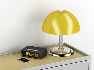 Image showing Nightstand with electric devices on it