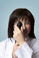 Image showing Eye doctor using opthalmoscope