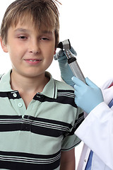 Image showing Doctor checking boys ears