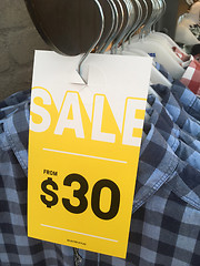 Image showing Racks of shirts on sale in shop