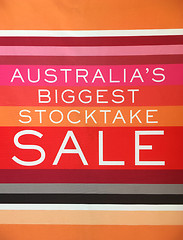 Image showing Stocktake Sale Banner hanging in shop front