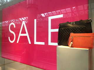 Image showing Sale Sign and handbags on display in shop front window