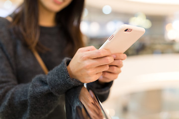 Image showing Woman working on cellphone, mobile office concept