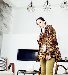 Image showing pretty stylish woman in fashion dress with leopard print together in luxury rich room interior, lifestyle people concept, modern brunette together 