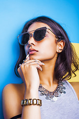 Image showing lifestyle people concept. young pretty smiling indian girl with long nails wearing lot of jewelry rings, asian summer happy cool