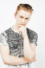 Image showing young handsome teenage hipster guy posing emotional, happy smiling against white background isolated, lifestyle people concept