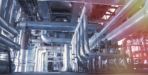 Image showing Equipment, cables and piping as found inside of a modern industr