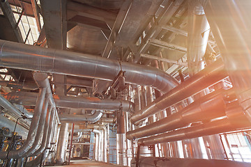 Image showing Equipment, cables and piping as found inside of a modern industr