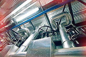 Image showing Equipment, cables and piping as found inside of a modern industr