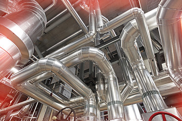 Image showing Equipment, cables and piping as found inside of a modern industr